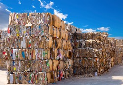 Stack of paper waste before shredding at recycling plant