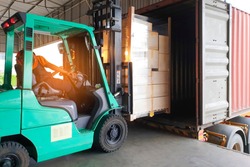 Cargo shipment loading for truck. Warehousing logistics and transportation, forklift driver loading cargo pallet into container truck . 
