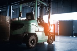 forklift tractor loader at the warehouse. truck parked loading at dock warehouse. road freight industry delivery, shipping warehouse logistics and transport.