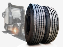Big Rig Semi Truck Wheels Tires on White Background. Lorry Tyres Rubber. Freight Trucks Transport. Auto Service Shop	
