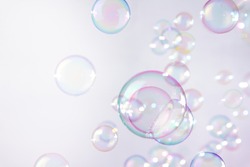 Pink soap bubbles float background
