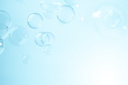 soap bubbles on blue natural background