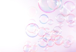 Beautiful pink soap bubbles float background.