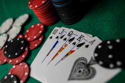 Poker Hands / Royal Flush 3. Five playing cards - the poker royal flush hand. Royal Flash, card deck, poker royal flash on cards and poker chips on green casino table. success in gambling. soft focus
