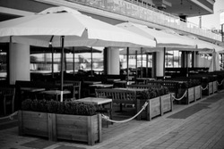 the interior of the summer bar on the banks of the marina. Interior of a summer bar on the banks of the river. Interior yacht club. Interior yacht club on the river bank. black and white photo