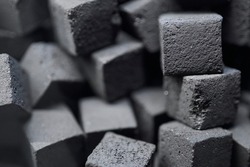 Charcoal for hookah. charcoal for hookah in the form of cubes. Coal for hookah in the form of a cube. The texture of cubes of coal close-up.