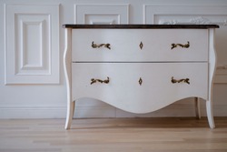 vintage chest of drawers on a light background