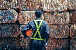 Engineer Standing and looking back The plastic bottle in the recycling industry