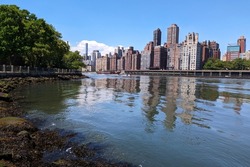 View of the East River on Roosevelt Island, with the Upper East Side in the Background