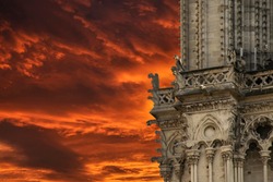Cathedral Notre Dame Paris, gargoyle incredible fiery red sunset