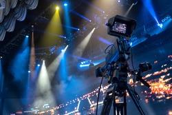 Professional digital video camera. tv camera in a concert hal.