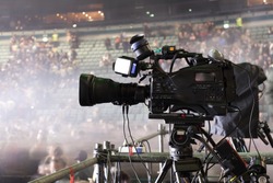 tv camera in a concert hal. Professional digital video camera.

TV broadcast of the event from the concert hall