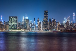 New York City Cityscape during Night Time with busy skyline and dense skyscrapers filling up the sky