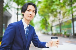Businessman taking a break with a cup of coffee at a cafe