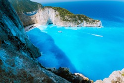 Navagio beach or Shipwreck bay with turquoise water and pebble white beach. Famous landmark location. Landscape of Zakynthos island, Greece