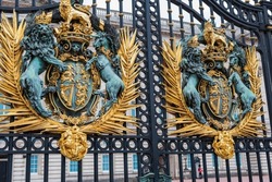 London, United Kingdom: Buckingham Palace, decorative entrance gate with Royal coat of arms