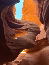 The lower Antelope Canyon, in the Navajo country is a spectacular travel destination for nature lovers. The scenic view is so beautiful that its beautiful colors have been used as Microsoft wallpaper