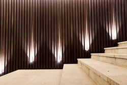 perspective view of night illumination of decorative slats of the stairs by spot lights