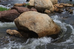 Big rocks in a rapid river ,Big rock in a stream,thailand