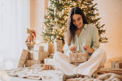 Woman opening her present on Christmas