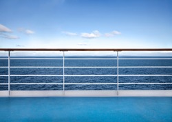 Railing of cruise ship deck against seascape. Travel concept background