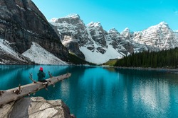 Beautiful turquoise waters, Moraine lake with snow-covered Rocky Mountains in the Banff National Park, Alberta, Canada
