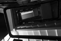 view of the ascending indoor staircase in monochrome