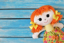 fun rag doll on wooden  background