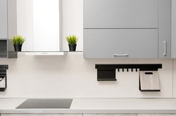 modern kitchen  in scandinavian style with hob, fume hood and countertop.
