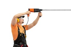 worker handyman repairman or builder worked with construction tool - hammer drill percussion perforator ,  in black - yellow uniform on white background, isolated. Repair service and construction 