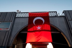 Turkish flag hanging on large bridge