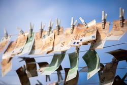 100 and 50 euro banknotes drying. Washed Euro paper bills. Drying euro on a string.Money laundering.Dirty money