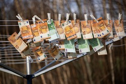 100 and 50 euro banknotes drying. Washed Euro paper bills. Drying euro on a string.Money laundering
