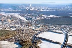 Aerial view of Ufa city russia white winter skyline. Big russian industrial cityscape from air. Satellite imagery of earth landscape at cold season. Town district road forest and snow scenery landmark