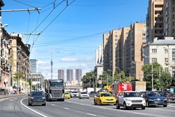 Downtown moscow city russia busy street with car traffic along 3rd ring highway landmark against city skyline background. Street view of modern city transportation infrastructure. Urban landscape
