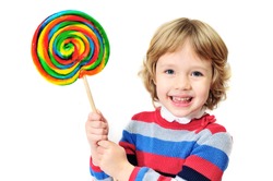 little laughing  girl holding big colorful lollipop