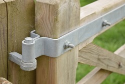 Metallic hinges of an outdoor wooden gate