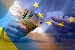 Financial and economical background. Europe helps Ukraine with money. Abstract Europe Ukraine politics relationship concept.
