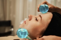Facial massage with cold spheres. High quality photo