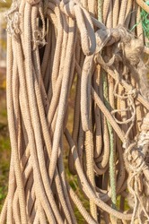 Rough rope background hanging in the street. abstract texture