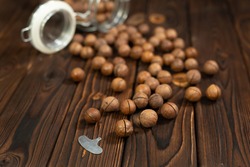 Macadamia nut close-up on brown wood background