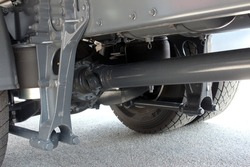 Truck driveshaft. Closeup of a car cardan drive shaft. Truck shaft axle of power transmission to wheel of truck car