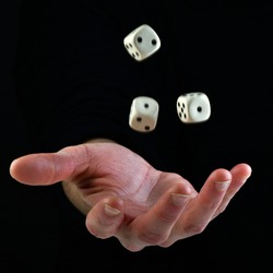 Female hand throwing dice in the air on black background. Fortune concept playing dice. luck concept. lucky man