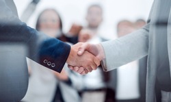 close up. confident business handshake on an office background.