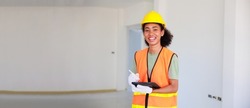 portrait happy smling black woman. Professional black femal engineers and inspectors investigating the neatness of houses under construction in housing projects.