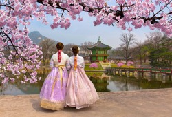 Cherry Blossom in spring with Korean national dress at Gyeongbokgung Palace  Seoul,South Korea.