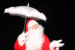 Santa Claus carries an umbrella while checking to see if its going to snow. Santa Claus weather. Christmas Snow. Snow for Christmas. Christmas Eve. Santa loves snow. 