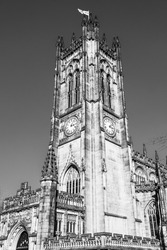 Manchester, Lancashire, England, UK - Tower of the cathedral of Manchester; the Cathedral and Collegiate Church of St Mary, St Denys and St George in black and white