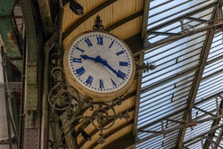 Clock at a traditional train station in Paris, France