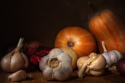 autumn still life in a rustic style on a dark wooden background.